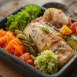 Japanese Bento Box With Fish And Vegetables