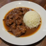 Plate Of Cooked Beef With Sauce