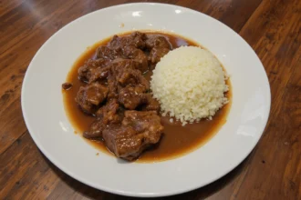 Plate Of Cooked Beef With Sauce