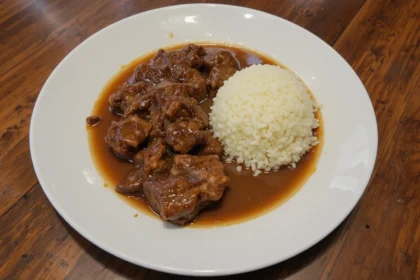 Plate Of Cooked Beef With Sauce