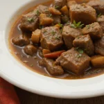 Plate Of Beef Stew With Herbs